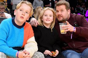 James Corden (R) and his kids Max Corden (L) and Carey Corden attend a basketball game between the Los Angeles Lakers and the Los Angeles Clippers at Crypto.com Arena on January 24, 2023 in Los Angeles, California