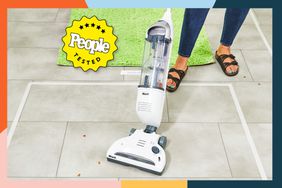 A person cleaning up the mess on the floor using the Shark Navigator Freestyle Cordless Vacuum