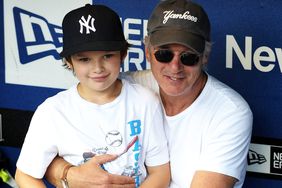 Richard Gere and his son Homer attend the New York Subway Series game between the Mets and Yannkees at Citi Field on June 26, 2009 in New York, New York