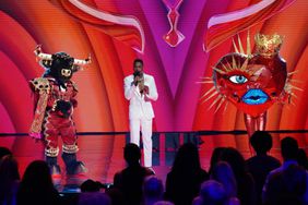 THE MASKED SINGER: L-R: Bull, host Nick Cannon and Queen of Hearts