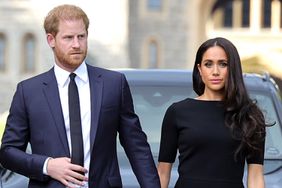 Prince Harry, Duke of Sussex, and Meghan, Duchess of Sussex arrive on the long Walk at Windsor Castle arrive to view flowers and tributes to HM Queen Elizabeth