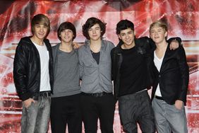 One Direction pose for a photocall to promote the X-Factor final held at The Connaught Hotel on December 9, 2010