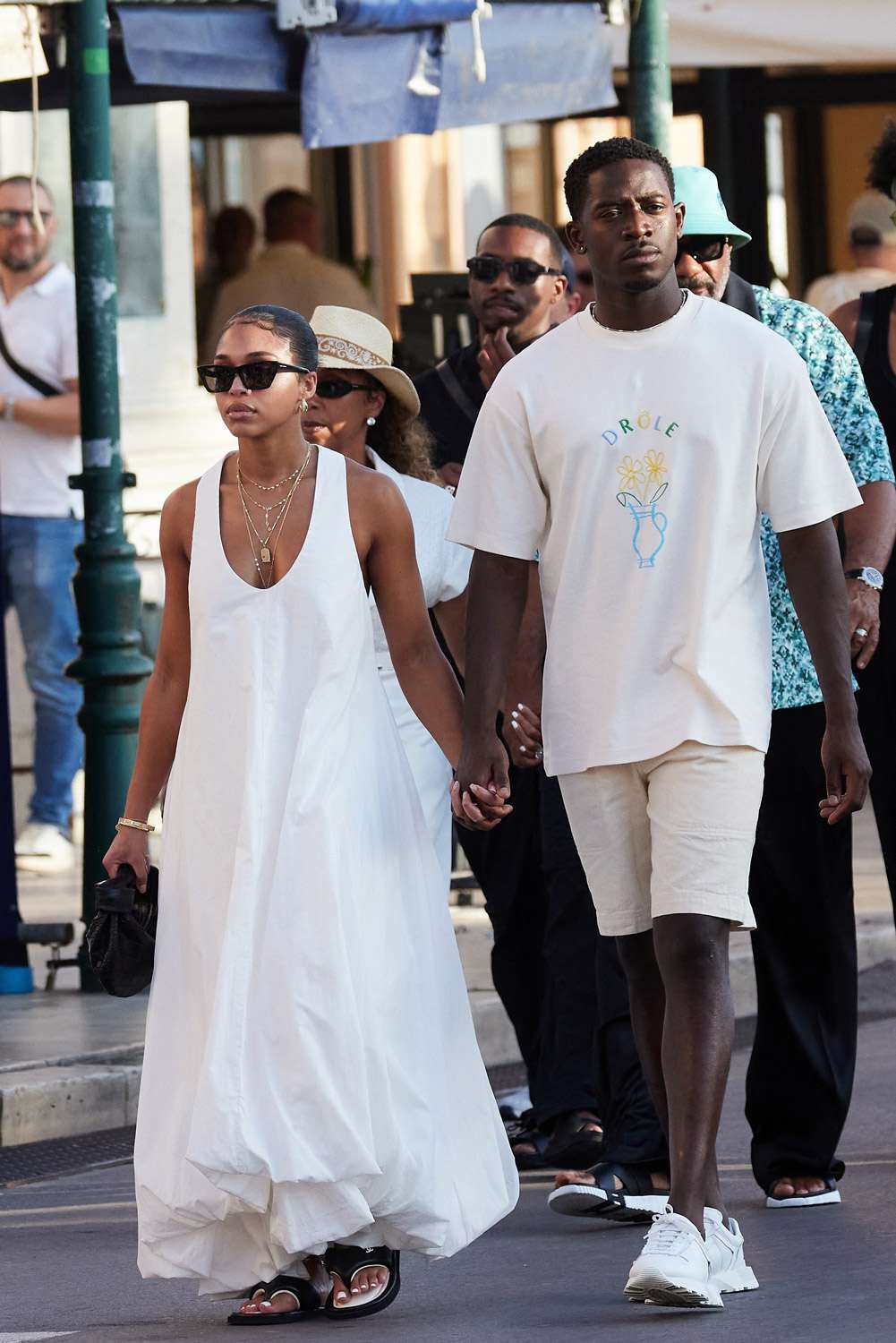 Damson Idris, accompanied by girlfriend Lori Harvey, joined by her mother Marjorie Bridges and brothers Wynton and Broderick Harvey Jr., enjoy a leisurely stroll through the charming streets of Saint-Tropez