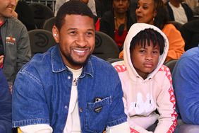 Usher Raymond and his son Usher Raymond V attend the game between Brooklyn Nets and the Atlanta Hawks at State Farm Arena on April 02, 2022 in Atlanta, Georgia.