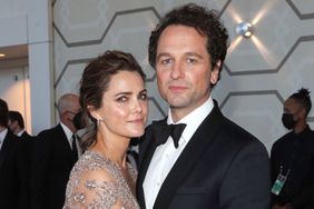 Keri Russell, left, and Matthew Rhys arrive at the 73rd Emmy Awards on at L.A. LIVE in Los Angeles FIJI Water on the Red Carpet at the 73rd Emmy Awards, Los Angeles, United States - 19 Sep 2021