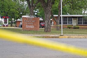 Sheriff crime scene tape is seen outside of Robb Elementary School as State troopers guard the area in Uvalde, Texas, on May 24, 2022. - An 18-year-old gunman killed 14 children and a teacher at an elementary school in Texas on Tuesday, according to the state's governor, in the nation's deadliest school shooting in years. (Photo by allison dinner / AFP) (Photo by ALLISON DINNER/AFP via Getty Images)
