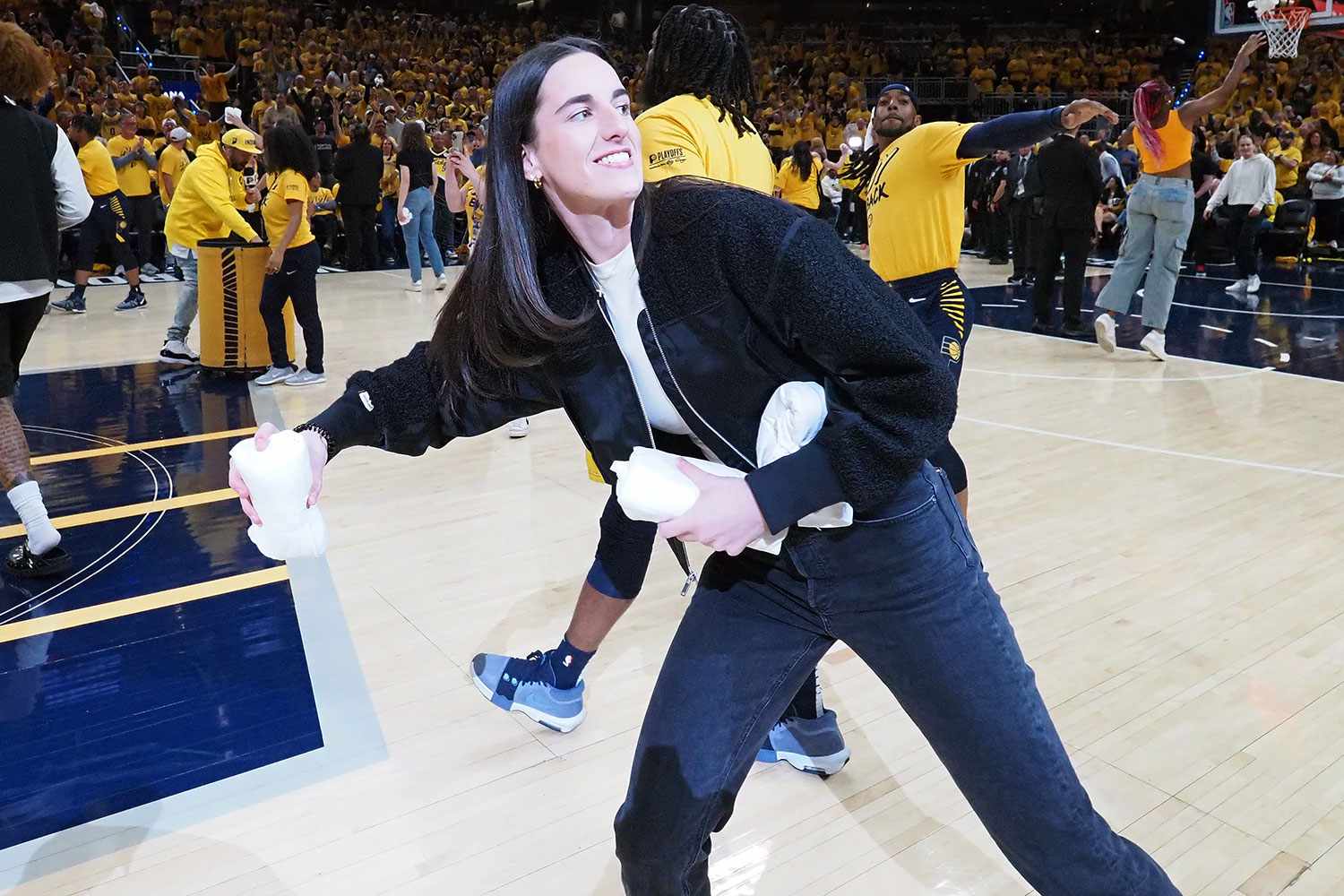 INDIANAPOLIS, IN - APRIL 26: Caitlin Clark #22 of the Indiana Fever throws out t-shirts during halftime of the game between the Milwaukee Bucks and the Indiana Pacers during Round 1 Game 3 of the 2024 NBA Playoffs on April 26, 2024 at Gainbridge Fieldhouse in Indianapolis, Indiana. NOTE TO USER: User expressly acknowledges and agrees that, by downloading and or using this Photograph, user is consenting to the terms and conditions of the Getty Images License Agreement. Mandatory Copyright Notice: Copyright 2024 NBAE 