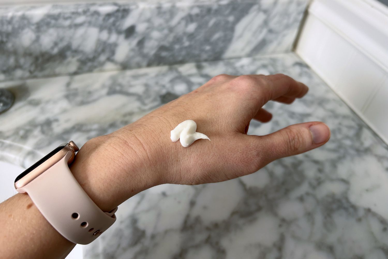 Dab of CeraVe Eczema Relief Creamy Oil on a person's hand