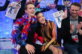 Madison Chock and Evan Bates of the United States react with their team mates after the Ice Dance Free Dance during the World Team Trophy at Tokyo Metropolitan Gymnasium on April 14, 2023 in Tokyo, Japan