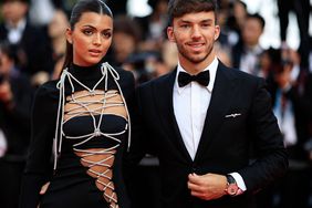 Pierre Gasly (R) and his partner Francisca Gomes arrive for the screening of the film "La Passion de Dodin Bouffant" (The Pot au Feu) during the 76th edition of the Cannes Film Festival