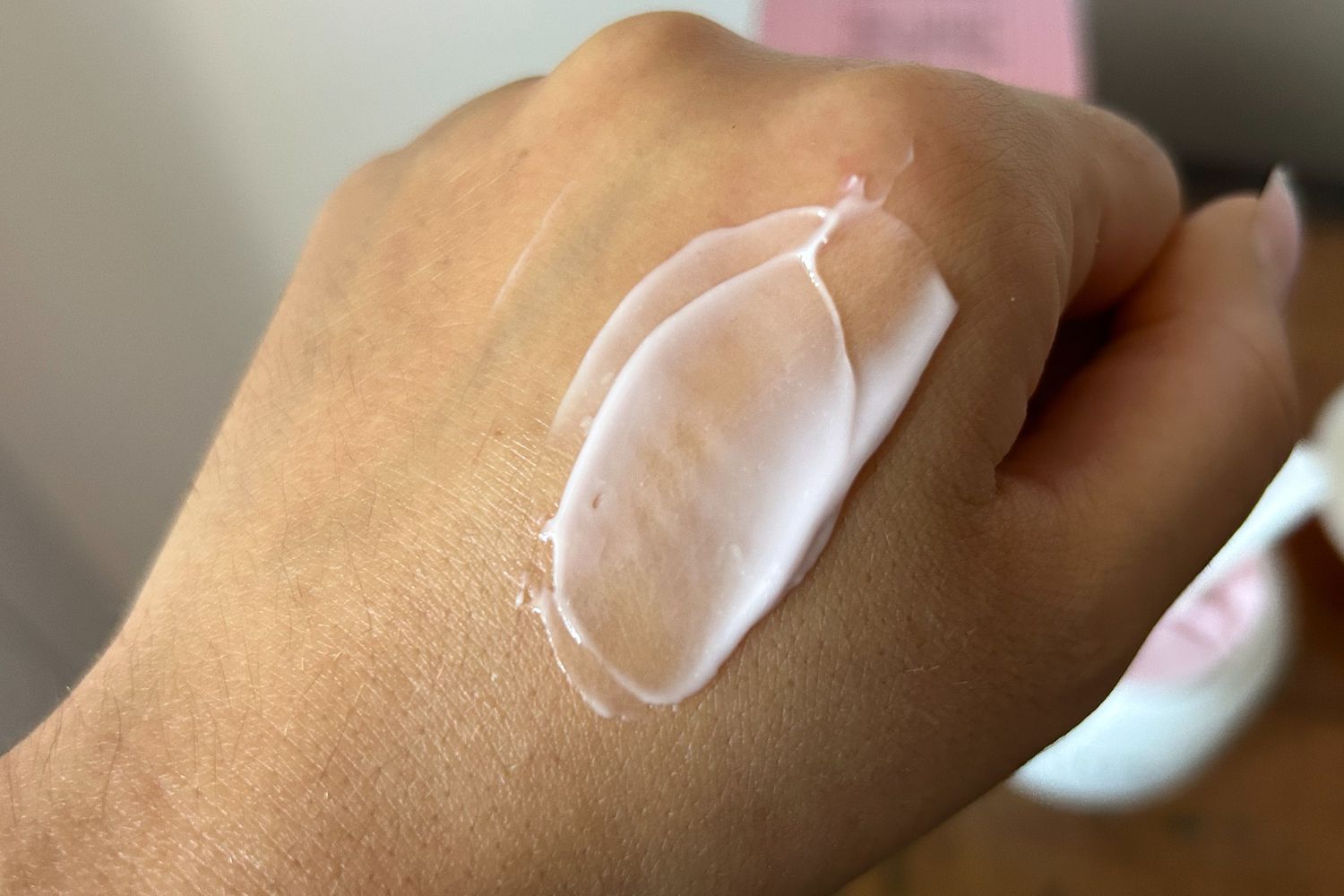 Lawless Forget the Filler Skin-Plumping Line-Smoothing Perfecting Cream on the back of a hand showing color and texture
