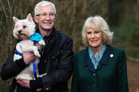 Camilla, Duchess of Cornwall (R) poses with Battersea Ambassador, Paul OGrady during her visit to Battersea Brand Hatch Centre