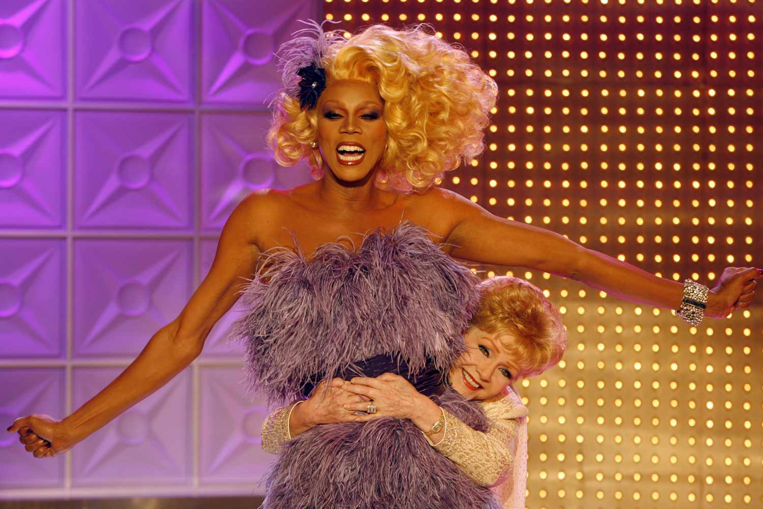 Debbie Reynolds gives a very tall RuPaul a hug during the taping of their episode together on RuPaul's Drag Race