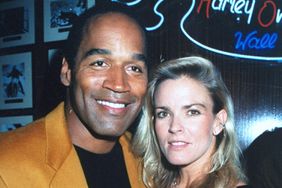 Football star turned actor O.J. Simpson with his arm around wife Nicole at the opening of the Harley Davidson Cafe. 