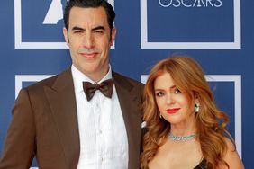 Sacha Baron Cohen (L) and Isla Fisher attend a screening of the Oscars on Monday April 26, 2021 in Sydney, Australia