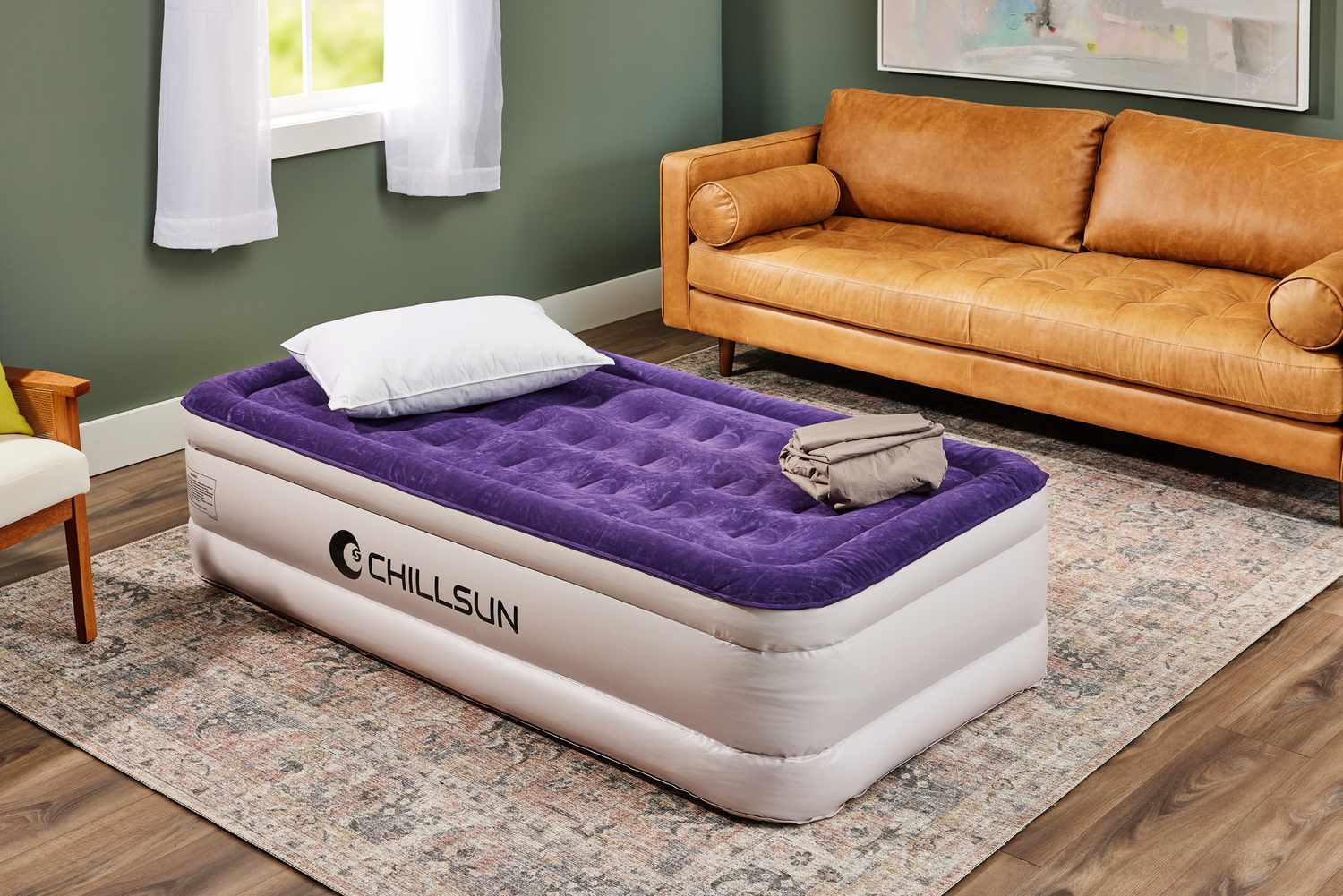 The Chillsun Twin Air Mattress fully inflated and set on a rug