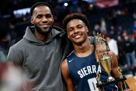 LeBron James, left, poses with his son Bronny after Sierra Canyon beat Akron St. Vincent - St. Mary in a high school basketball game, Saturday, Dec. 14, 2019, in Columbus, Ohio.