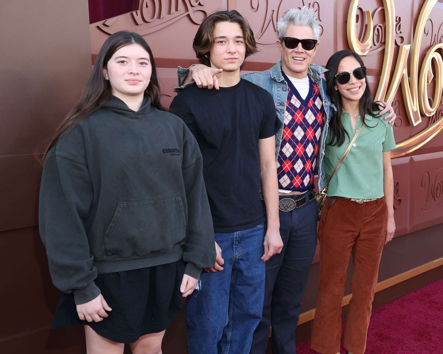 Arlo Clapp, Rocko Akira Clapp, Johnny Knoxville and Emily Ting attend the Los Angeles Premiere of Warner Bros. "Wonka" at Regency Village Theatre on December 10, 2023