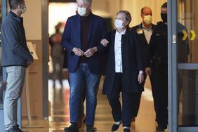 Former President Bill Clinton, standing with his wife, Hillary, was discharged from UC Irvine Medical Center Sunday morning, six days after he was admitted and treated for a urological and blood infection, Orange, California on October 17, 2021.
