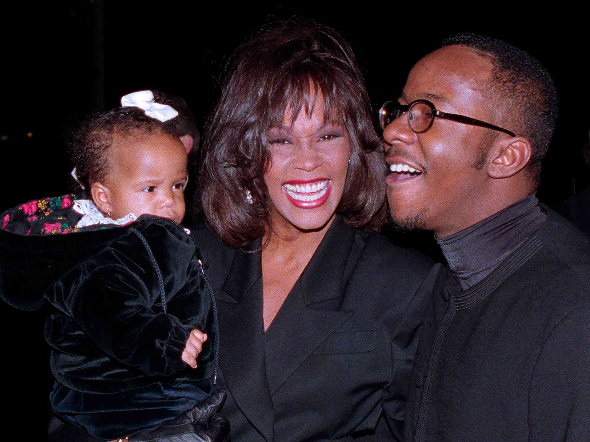 Whitney Houston, daughter Bobbi Kristina, and husband Bobby Brown arrive at Tavern On the Green in NYC for Bobby's 25th Birthday party on February 4, 1994