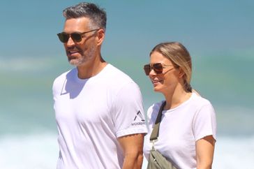 LeAnn Rimes and husband, actor Eddie Cibrian, hold hands as they enjoy a 