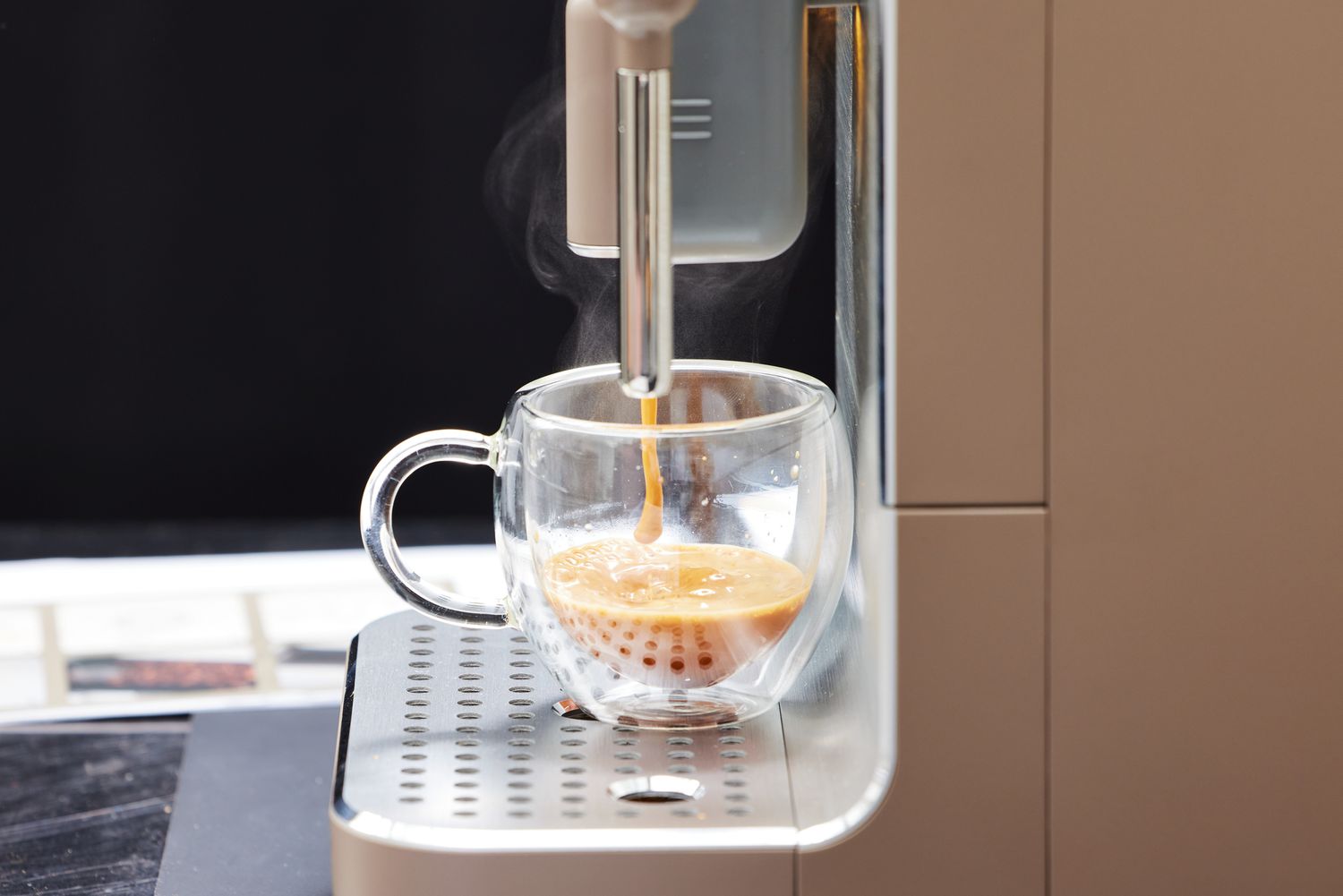 Espresso being brewed using the SMEG Medium Fully-Automatic Coffee Machine.