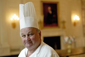 White House pastry chef Roland Mesnier from Bonnay, France, poses in the State Dining Room of the White House 14 June, 2004, in Washington, DC. Mesnier, 60, announced he will retire from his post at the White House 30 July, 2004, after 25 years of service.