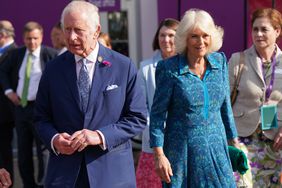  Britain's King Charles III and Britain's Queen Camilla visit the 2024 RHS Chelsea Flower Show on May 20, 2024 in London, England. The Chelsea flower show is held annually in the grounds of the Royal Hospital Chelsea. 