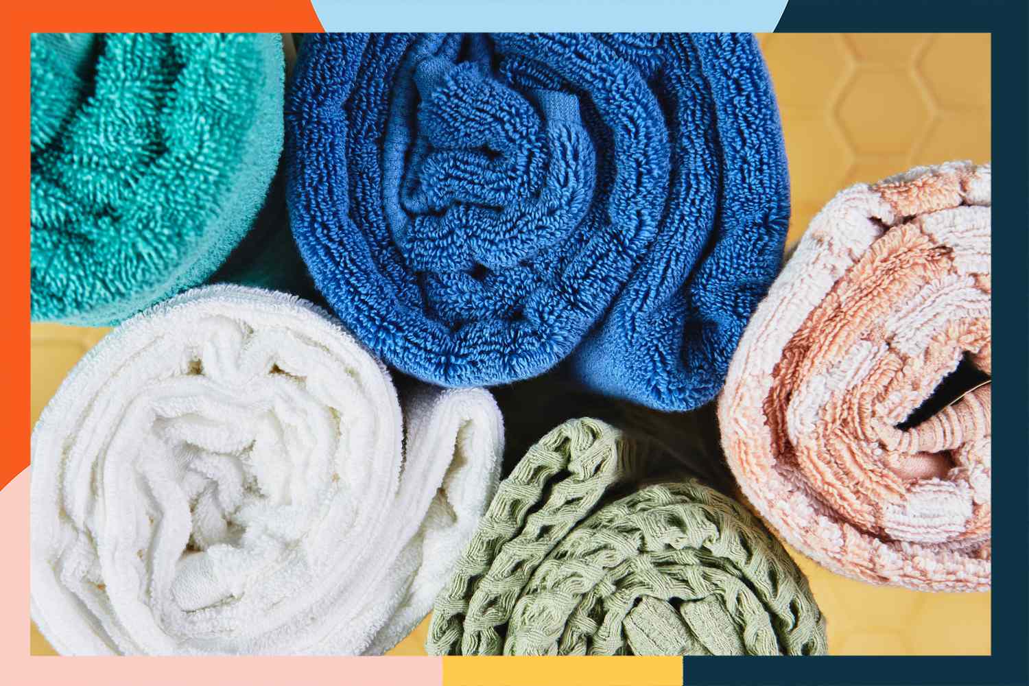Close up of a variety of bath towels rolled up