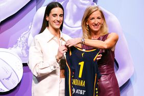 Caitlin Clark poses with WNBA Commissioner Cathy Engelbert after being selected first overall pick by the Indiana Fever during the 2024 WNBA Draft at Brooklyn Academy of Music on April 15, 2024 in New York City. 