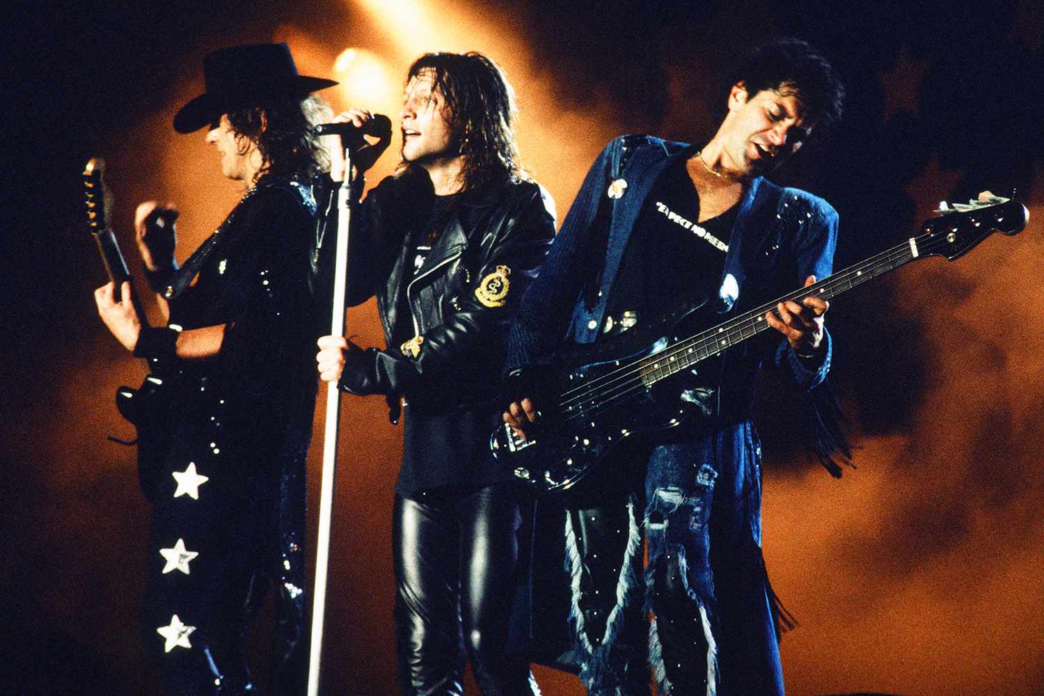 Bon Jovi, live, Moscow Music Peace Festival 1989 at Luzhniki Stadium, Moscow, USSR, 12th and 13th August, 1989. (L-R) Richie Sambora (guitar), Jon Bon Jovi (vocals), Alec John Such (bass). 