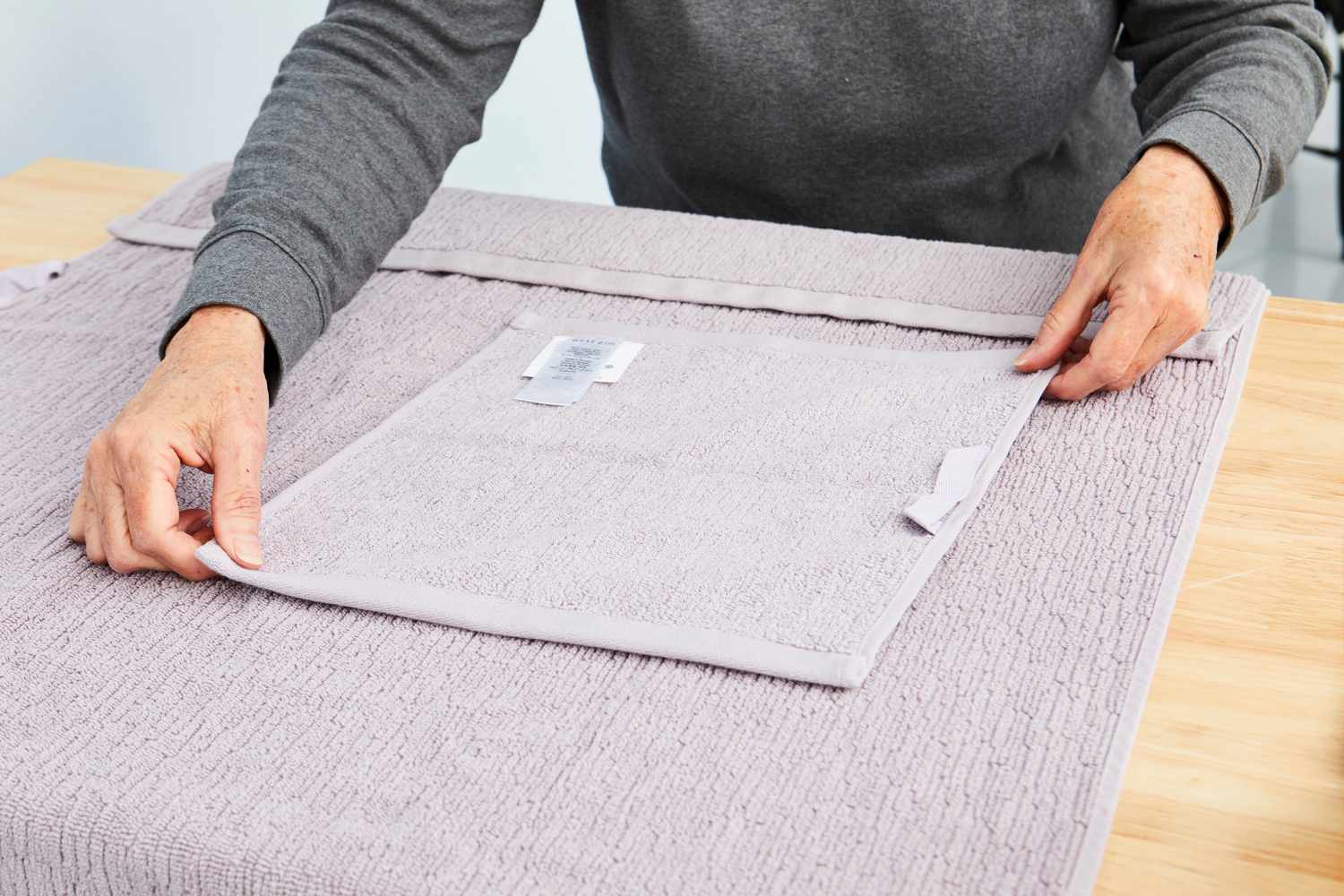 person touching West Elm Everyday Textured Organic Towels