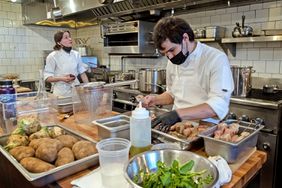 LOS ANGELES, CA - DECEMBER 23, 2021: Chefs Liz Johnson and Will Aghajanian prep dishes before dinner service at Horses restaurant off Sunset Boulevard on December 23, 2021 in Los Angeles, California.(Gina Ferazzi / Los Angeles Times via Getty Images)