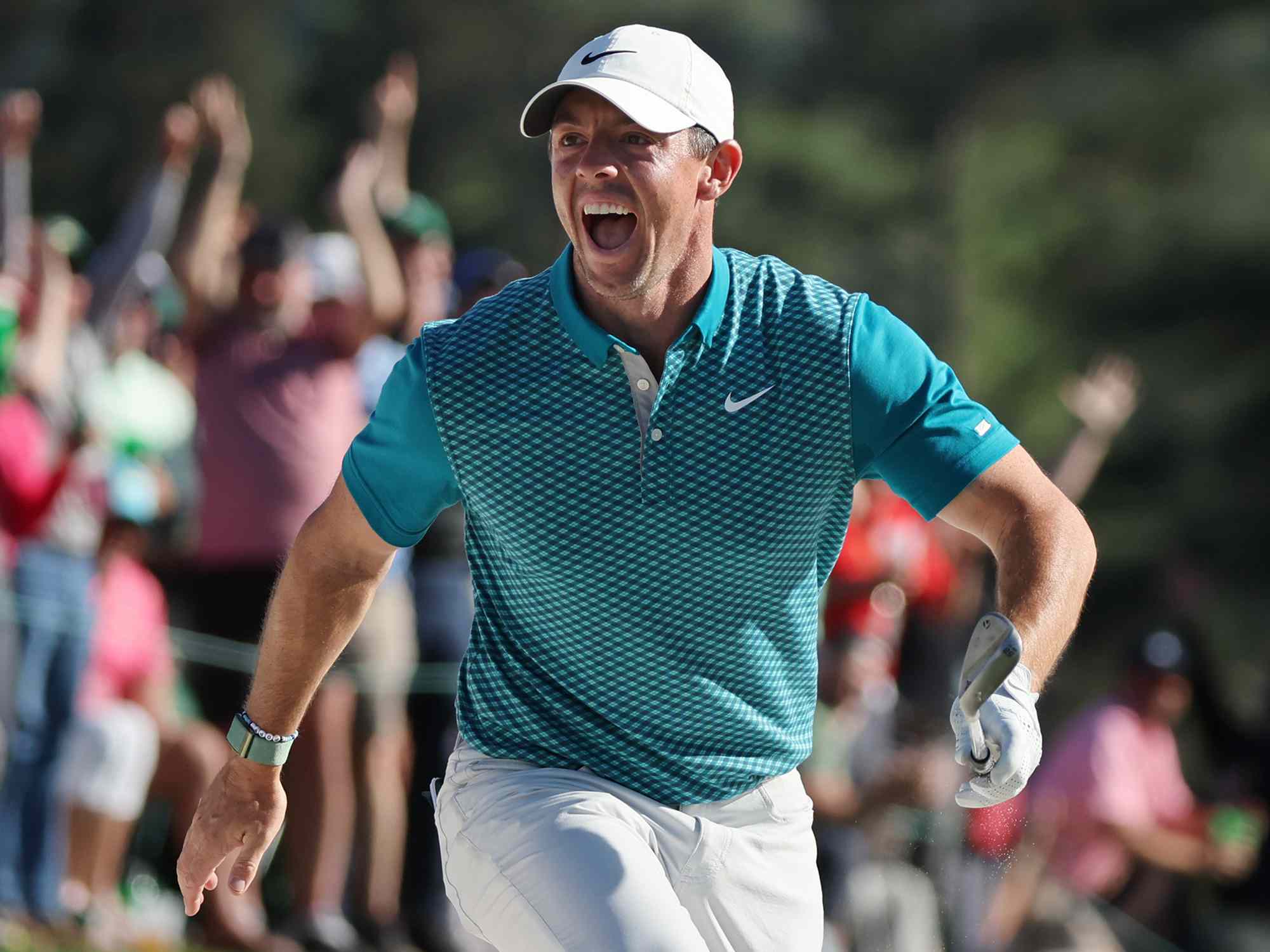 Rory McIlroy of Northern Ireland reacts after chipping in for birdie from the bunker on the 18th green during the final round of the Masters at Augusta National Golf Club on April 10, 2022