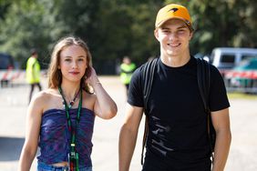 Oscar Piastri and Lily Zneimer during practice ahead of the F1 Grand Prix of Italy at Autodromo Nazionale Monza on September 1, 2023.