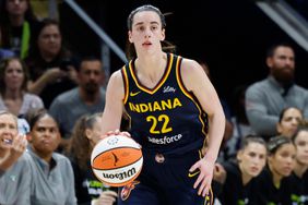 Indiana Fever guard Caitlin Clark (22) moves upcourt against the Dallas Wings during the first half of an WNBA basketball game in Arlington, Texas, Friday, May 3, 2024