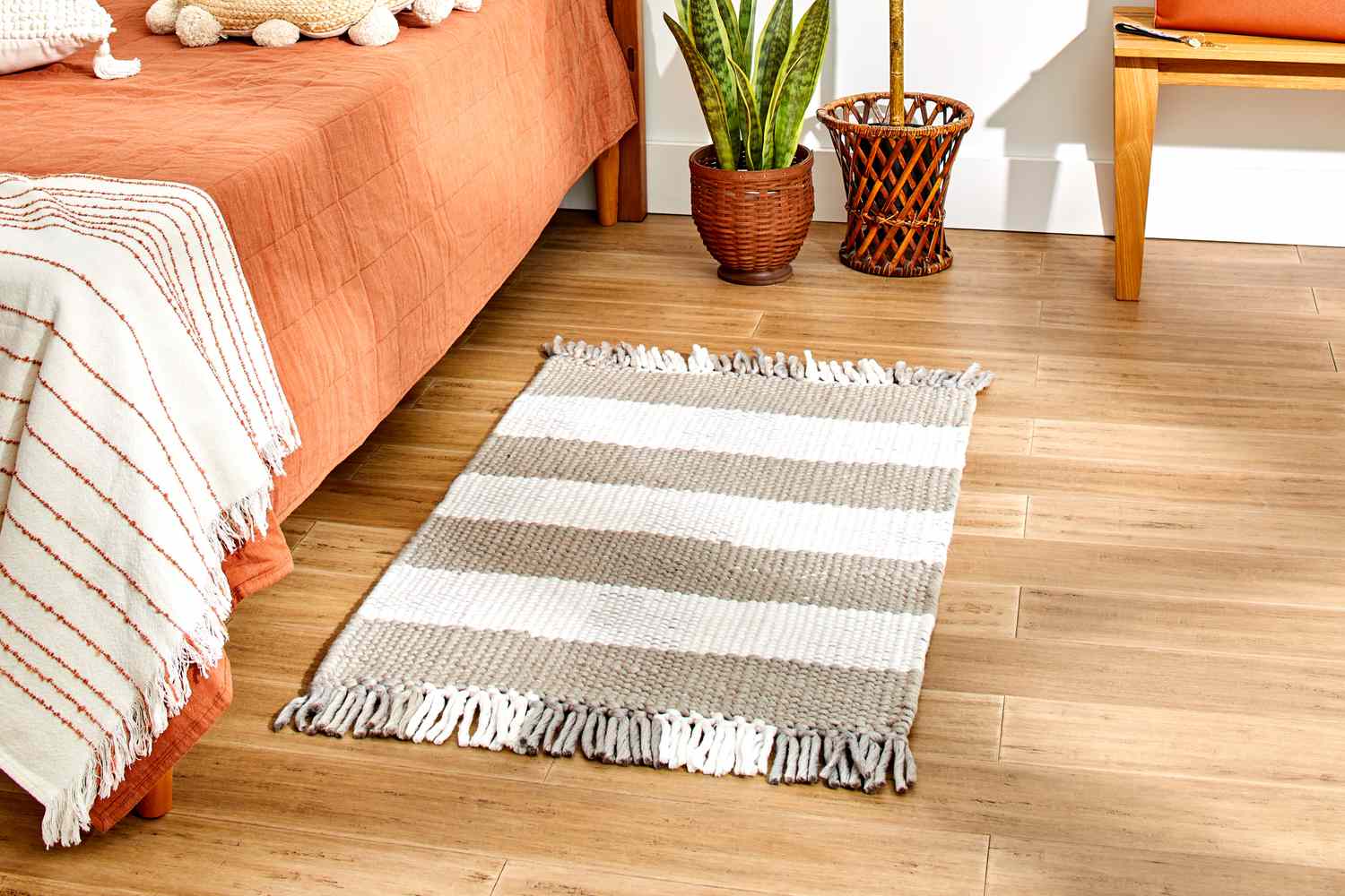 The Rugs.com Washable Eco Plaid Indoor/Outdoor Rug in a bedroom setting