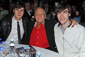 Playboy founder Hugh Hefner (C) poses with his sons Cooper and Marston Hefner at the Thalians 55th Annual Gala at the Playboy Mansion on April 30, 2011 in Los Angeles, California. 