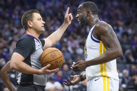 Golden State Warriors forward Draymond Green, right, argues with referee Gediminas Petraitis in the first half during Game 1 in the first round of the NBA basketball playoffs