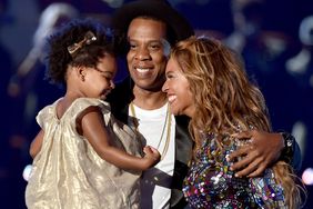 Jay Z and singer Beyonce with daughter Blue Ivy Carter onstage during the 2014 MTV Video Music Awards at The Forum on August 24, 2014 in Inglewood, California