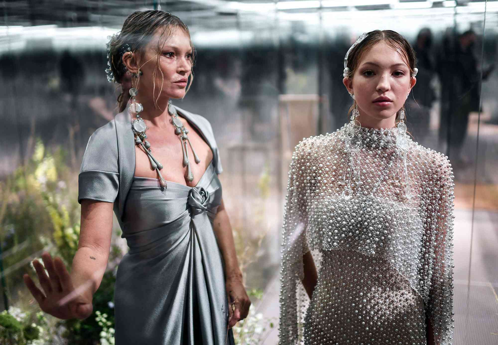 Kate Moss (L) and her daughter British model Lila Grace Moss-Hack present creations by British designer Kim Jones for Fendi's Spring-Summer 2021 collection during the Paris Haute Couture Fashion Week in Paris, on January 27, 2021.