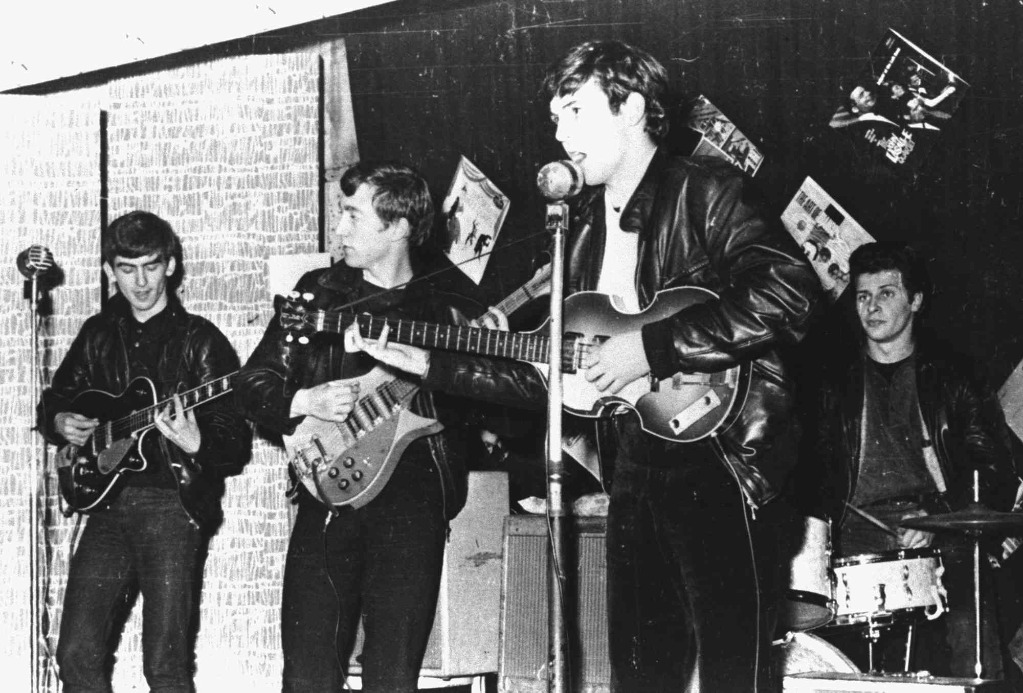 The Beatles perform in a club in Liverpool, England, in 1962.
