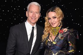Anderson Cooper and Madonna pose together at the Billboard Women in Music 2016 event on December 9, 2016 in New York City.