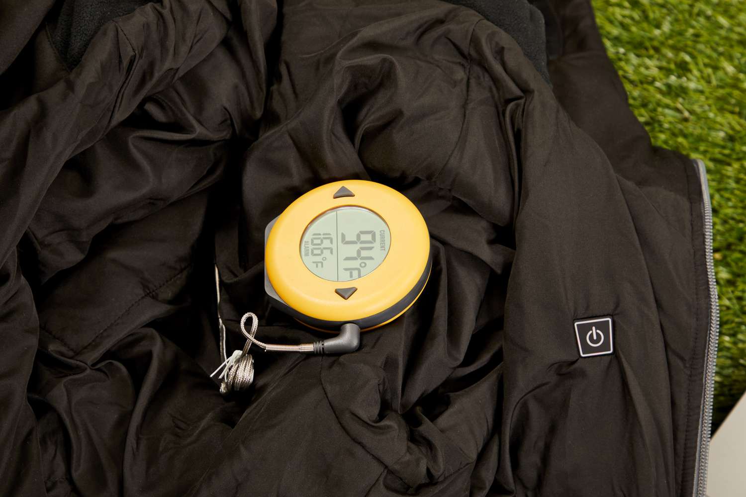 Thermometer showing a reading of 94 degrees F from a Conqueco Women's Slim-fit Heated Jacket