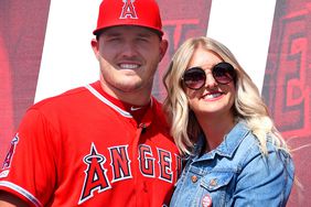 Mike Trout #27 of the Los Angeles Angels of Anaheim poses for a photo with his wife Jessica