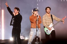 Nick Jonas, Joe Jonas and Kevin Jonas of The Jonas Brothers perform onstage during AT&T Playoff Playlist Live 