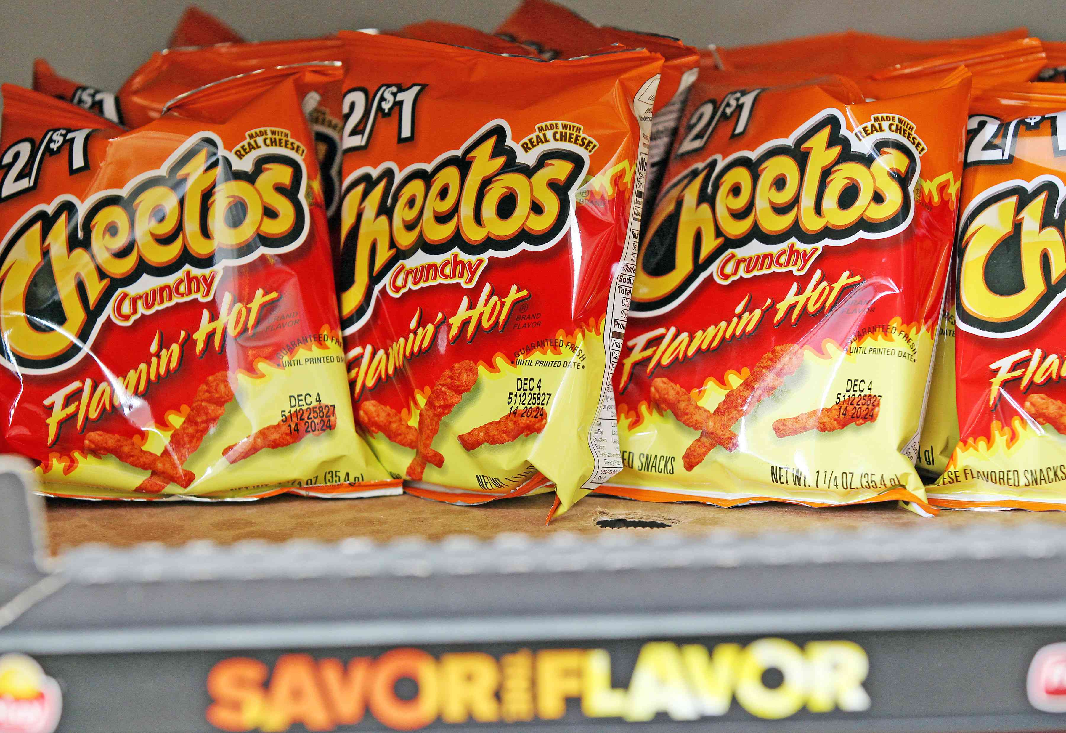 Bags of Cheetos Flamin' Hot Crunchy are displayed for sale at Touchdown Food Mart, September 27, 2012, in Chicago, Illinois. (John J. Kim/Chicago Tribune/Tribune News Service via Getty Images)