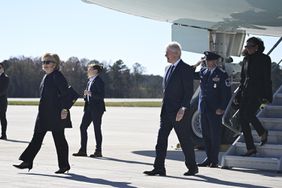 Former US President Bill Cliton and former US First Lady Hillary Clinton disembark Air Force One at Dobbins Air Reserve Base in Marietta, Georgia, on November 28, 2023
