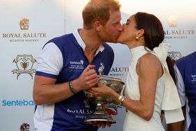 Prince Harry and Meghan kiss as they attend the Royal Salute Polo Challenge to benefit Sentebale