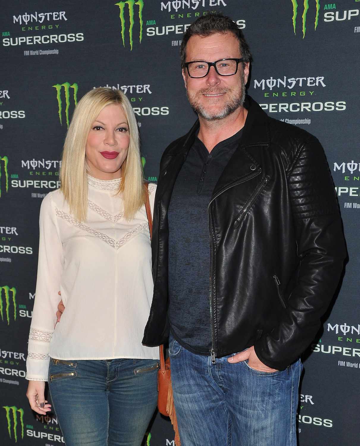 Actress Tori Spelling and actor Dean McDermott attend Monster Energy Supercross at Angel Stadium of Anaheim on January 23, 2016 in Anaheim, California. 